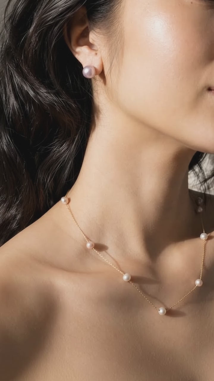 Lavender pearl stud worn on ear, showing its 8–9mm size_video